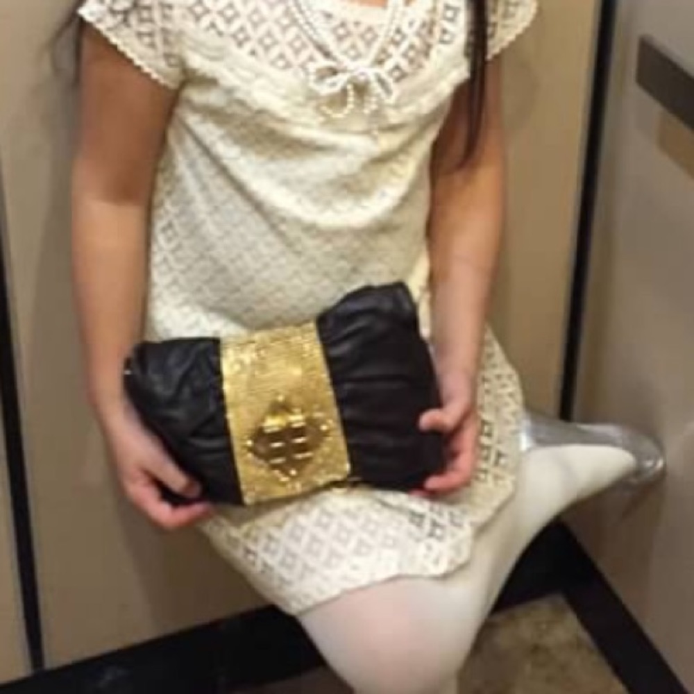 Brown with gold accents BCBG clutch